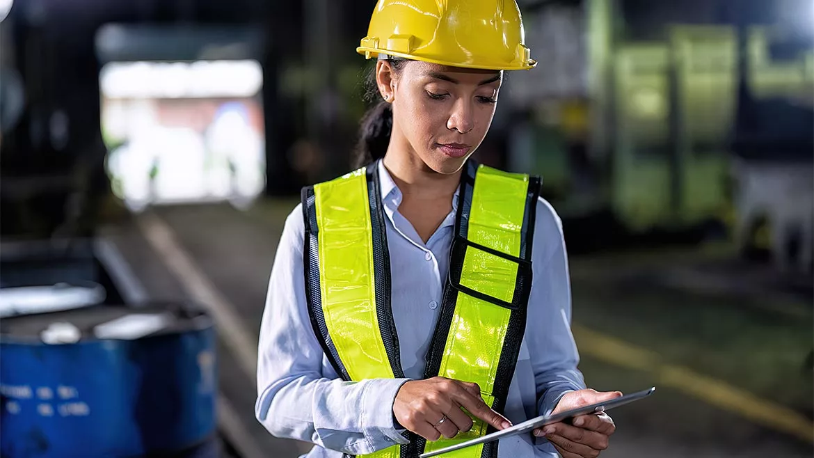 Software and Analysis B feature, female worker in hardhat