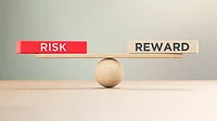 Wooden Seesaw Scale and Risk and Reward Written Wooden Blocks Wooden Seesaw Scale and Risk and Reward Written Wooden Blocks Sitting on Wood Surface in Front of Defocused Background