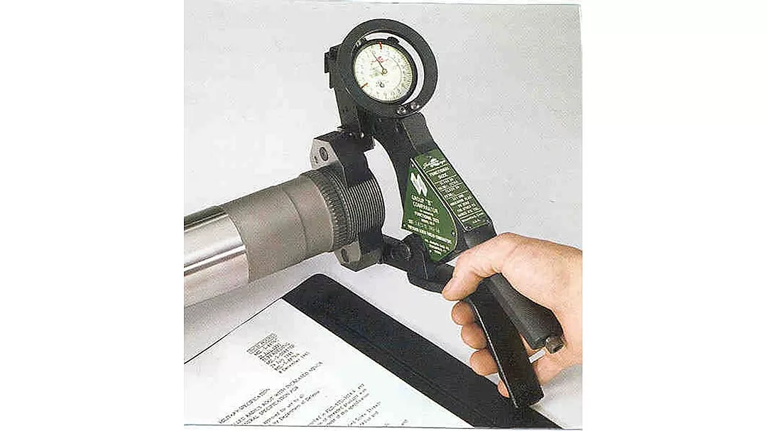 Hand holding a pressure gauge