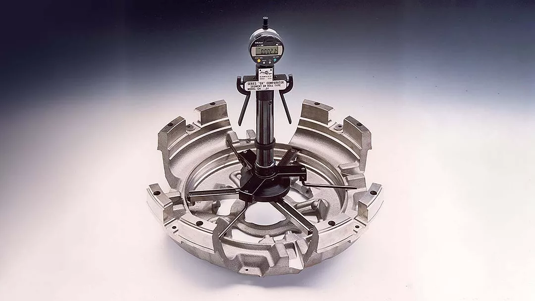 Metal object connected to a thread gage