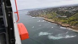 View of the La Jolla area coastline from within the Jayhawk helicopter.
