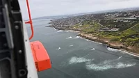View of the La Jolla area coastline from within the Jayhawk helicopter.