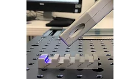 PSL metrology head measuring a chamfer on a machined chamfer and radius standard.