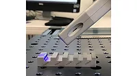 PSL metrology head measuring a chamfer on a machined chamfer and radius standard.