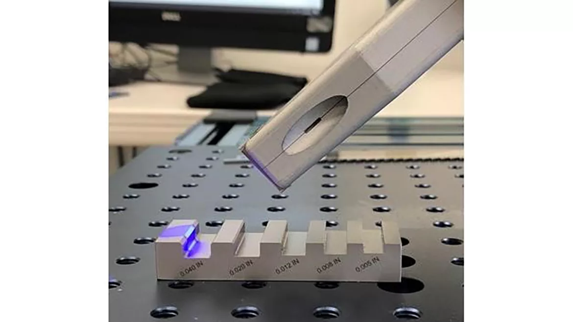 PSL metrology head measuring a chamfer on a machined chamfer and radius standard.