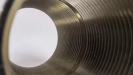 Close-up of circle tube with spiral inside, tunnel of spiral