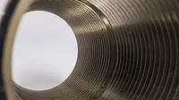 Close-up of circle tube with spiral inside, tunnel of spiral