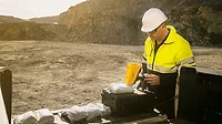 Portable and handheld XRF analyzer being used onsite.