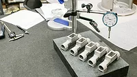 3D printing metal DMLS log pieces inspection DMLS aluminum parts undergoing inspection