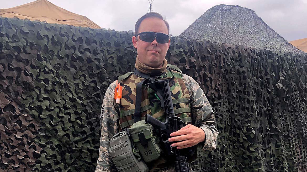 Justin Wise on base in full fatigue uniform weating sunglasses