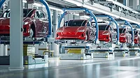 EV Production Line on Advanced Automated Smart Factory. High Performance Electric Car Manufacturing. Car Batteries Installation on Electric Vehicles on Assembly line. Automotive Plant.