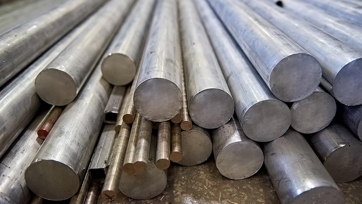 Pile of metal rods. Stainless steel bars.