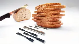 Slicing bread with a steel blade.