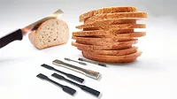 Slicing bread with a steel blade Slicing bread with a steel blade.