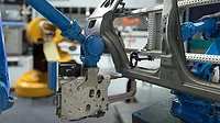 Automobile manufacturing production, robot arm in smart factory.