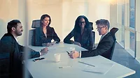 Executive team having a meeting in a contemporary, modern conference meeting room.