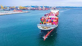 Container ship transporting containers leaving the container port.