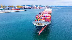 Container ship transporting containers leaving the container port.