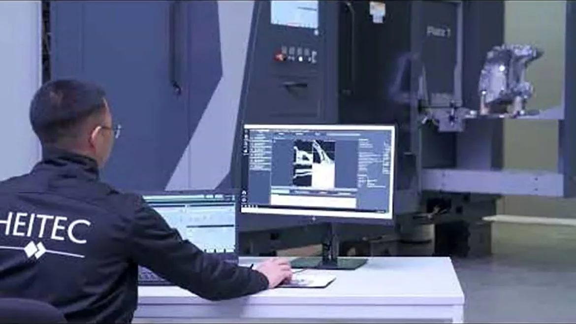 An engineer monitoring a robotic CT scan and analysis system as it inspects a manufactured component. Image courtesy of Heitec