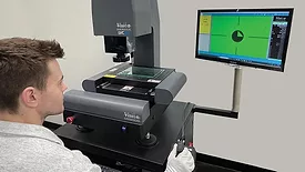 Technician working with the Vision Engineering LVC200.