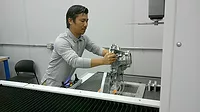 Quality Auditor Kam Khai prepares to measure a part with a ZEISS PRISMO ultra CMM.