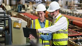 The project manager and engineer inspect workpieces and verify standards and safety protocols for products and ensure safety in the factory.