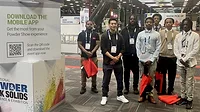 Students standing in a group at an event
