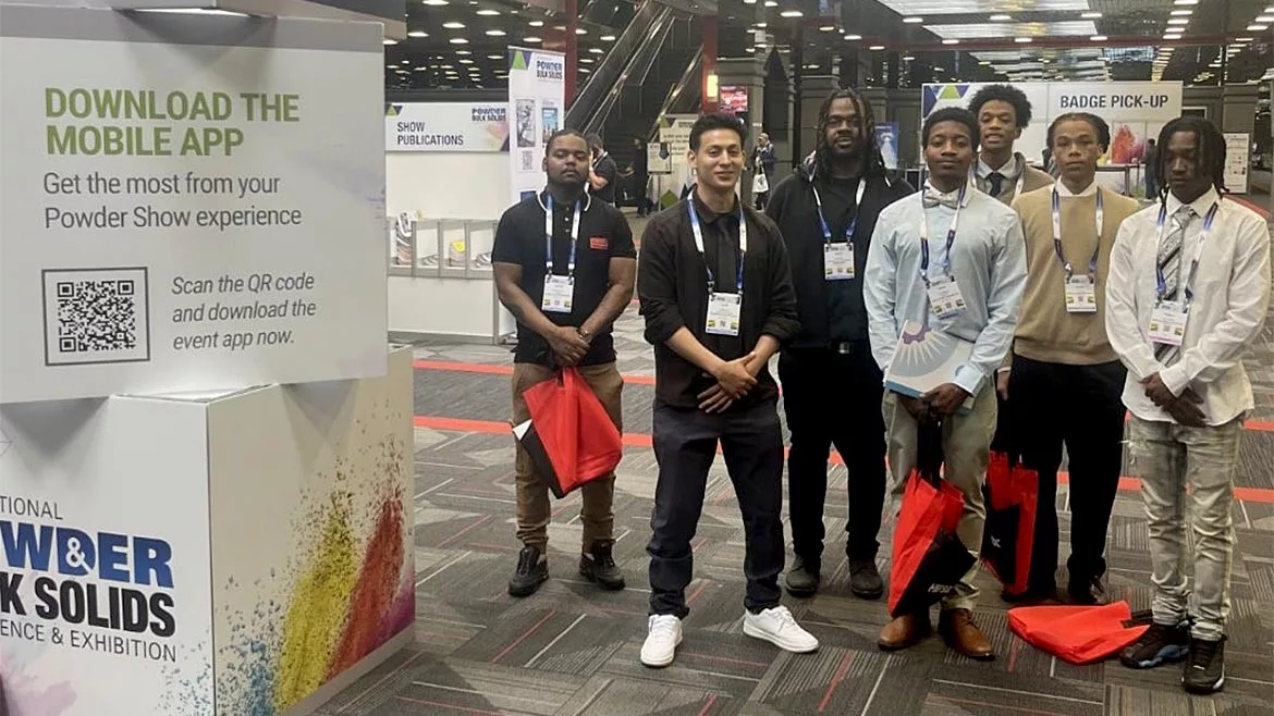 Students standing in a group at an event