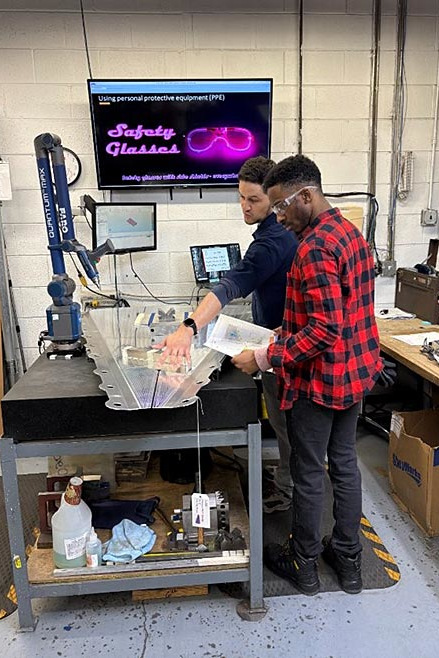 Two students at a workstation