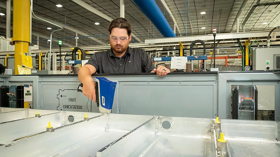 This handheld XRF analyzer is used to analyze coatings in automotive manufacturing to help ensure quality.
