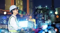 Female engineer working in the factory Female engineer working in the factory. Virtual technology concepts floating in front her.
