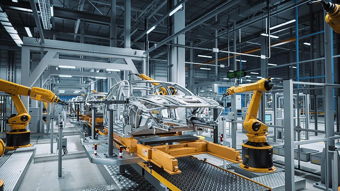 Automated Robot Arm Assembly Line Manufacturing High-Tech Green Energy Electric Vehicles.