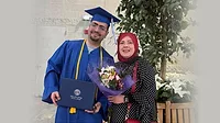 Ibrahim Intabli at his graduation posing with his mother Ibrahim Intabli at his graduation posing with his mother.