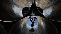 An engineer checking industrial pipes.