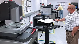 View of the CEI Quality Lab, including 2 Starrett AV450 Vision Systems. (Left Back) David Holland, CEI Quality Inspector. (Right Front) Eric Boyea, CEI Quality Manager.