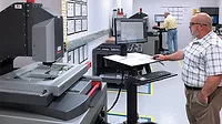View of the CEI Quality Lab, including 2 Starrett AV450 Vision Systems. (Left Back) David Holland, CEI Quality Inspector. (Right Front) Eric Boyea, CEI Quality Manager.