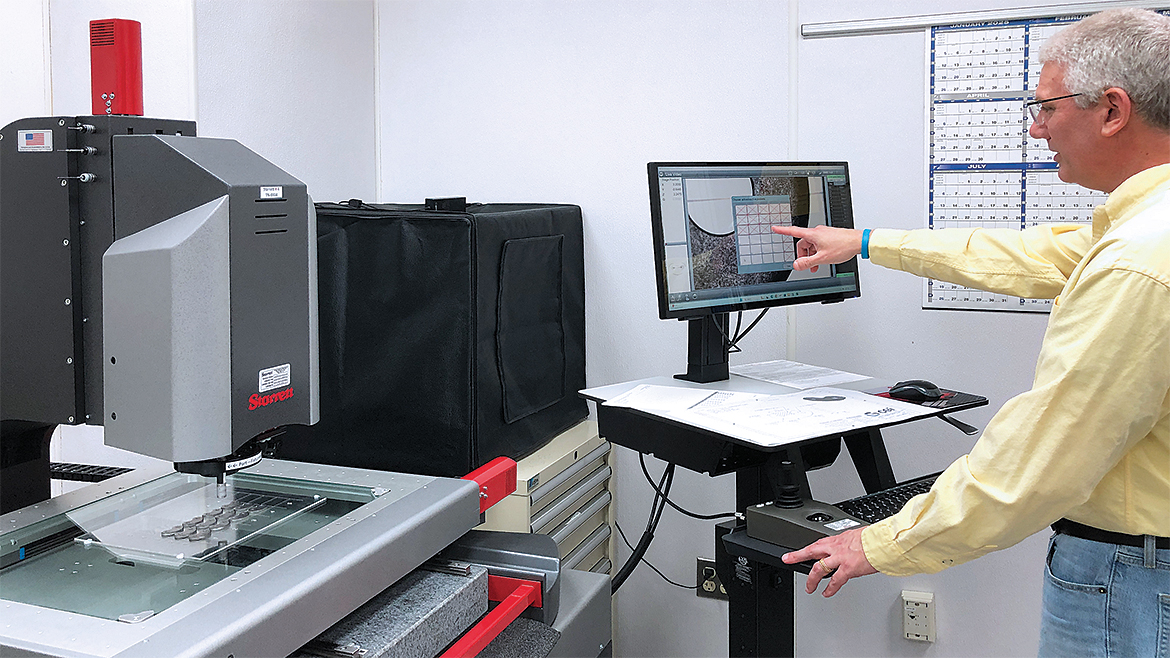 David Holland, CEI Quality Inspector, performs an efficient palletized inspection routine using automatic pattern recognition technology on stamped 'rocker' parts.