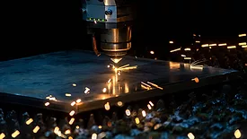 High-tech tool in operation with sparks flying.