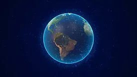 A glowing planet Earth with an outer layer, pictured from space.