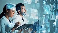 Two medical professionals looking at superimposed medical records Two medical professionals looking at superimposed medical records.