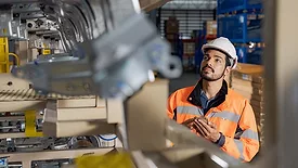 an industrial engineer working in a factory or similar environment