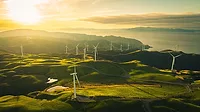 sunlit picture of a wind farm 