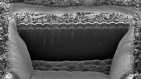 a microscopic cross-section showing a high aspect ratio structure