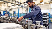 Man working at a water pump factory.