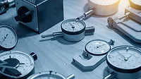 The group of dial indicator gauge on the table with lighting effect.