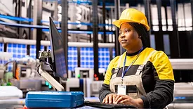 Automated factory engineer analyzing smart manufacturing system.