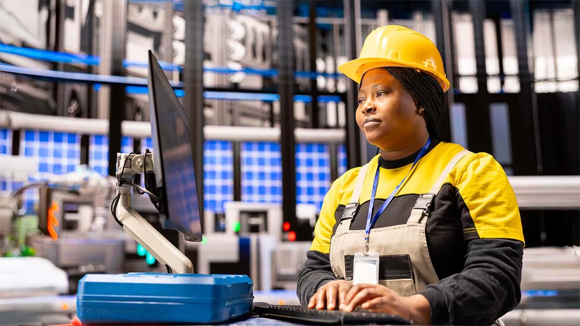 Automated factory engineer analyzing smart manufacturing system.