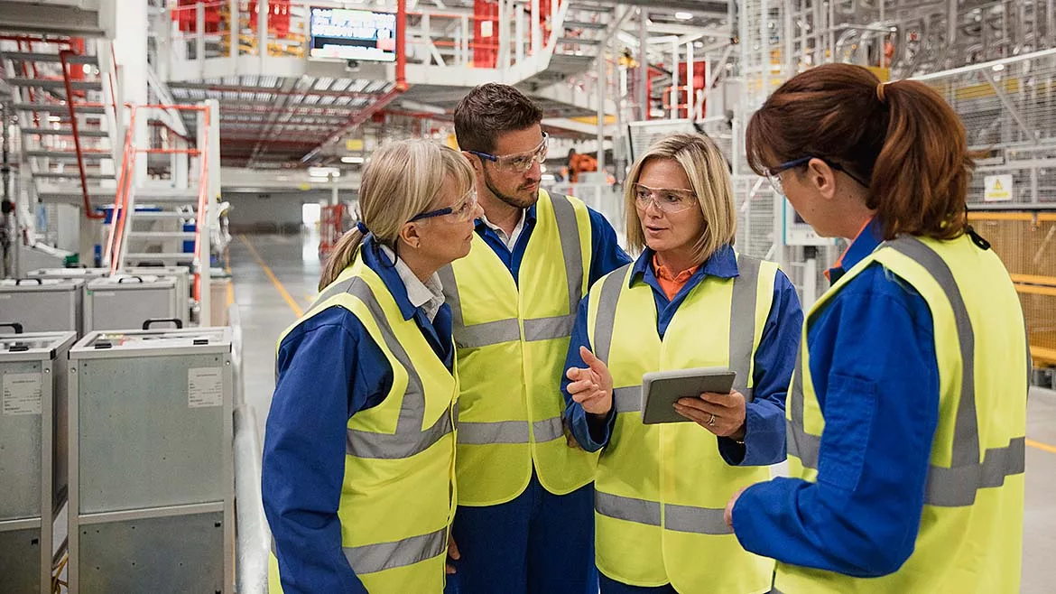 factory workers having a conversation