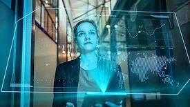 a person looking at a holographic data visualization. 