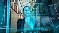 a person looking at a holographic data visualization. 